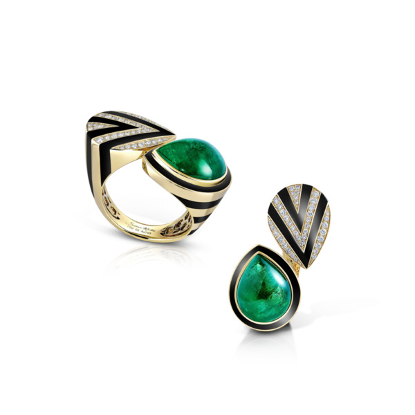 Emerald and black composite ring with diamond accents in a modern design.